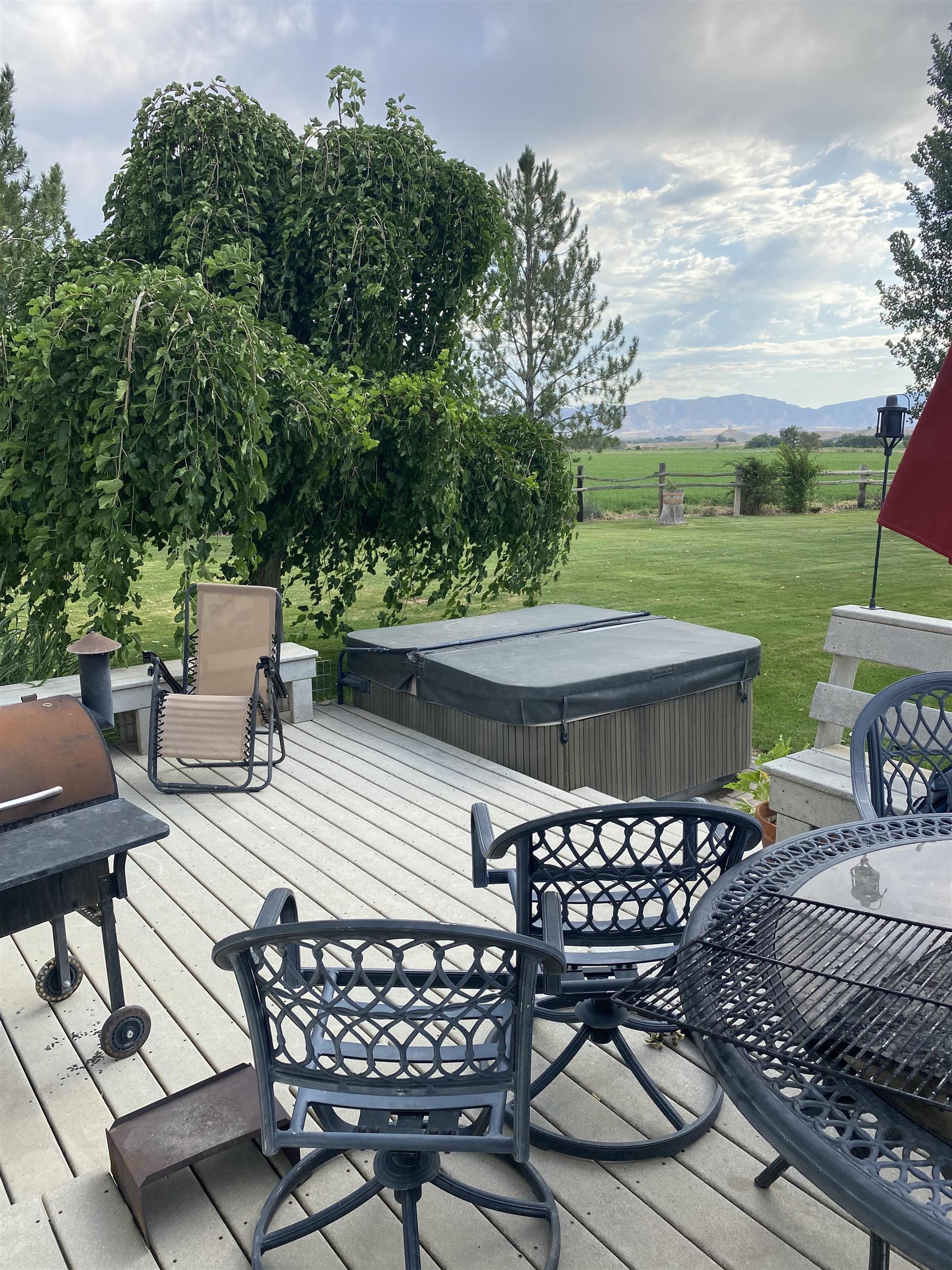 1456 17 Road Fruita, CO 81521 - Photo 33 of 42 a view of a patio with table and chairs and potted plants