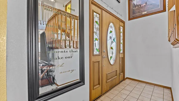 a kitchen with stainless steel appliances granite countertop a refrigerator stove and sink