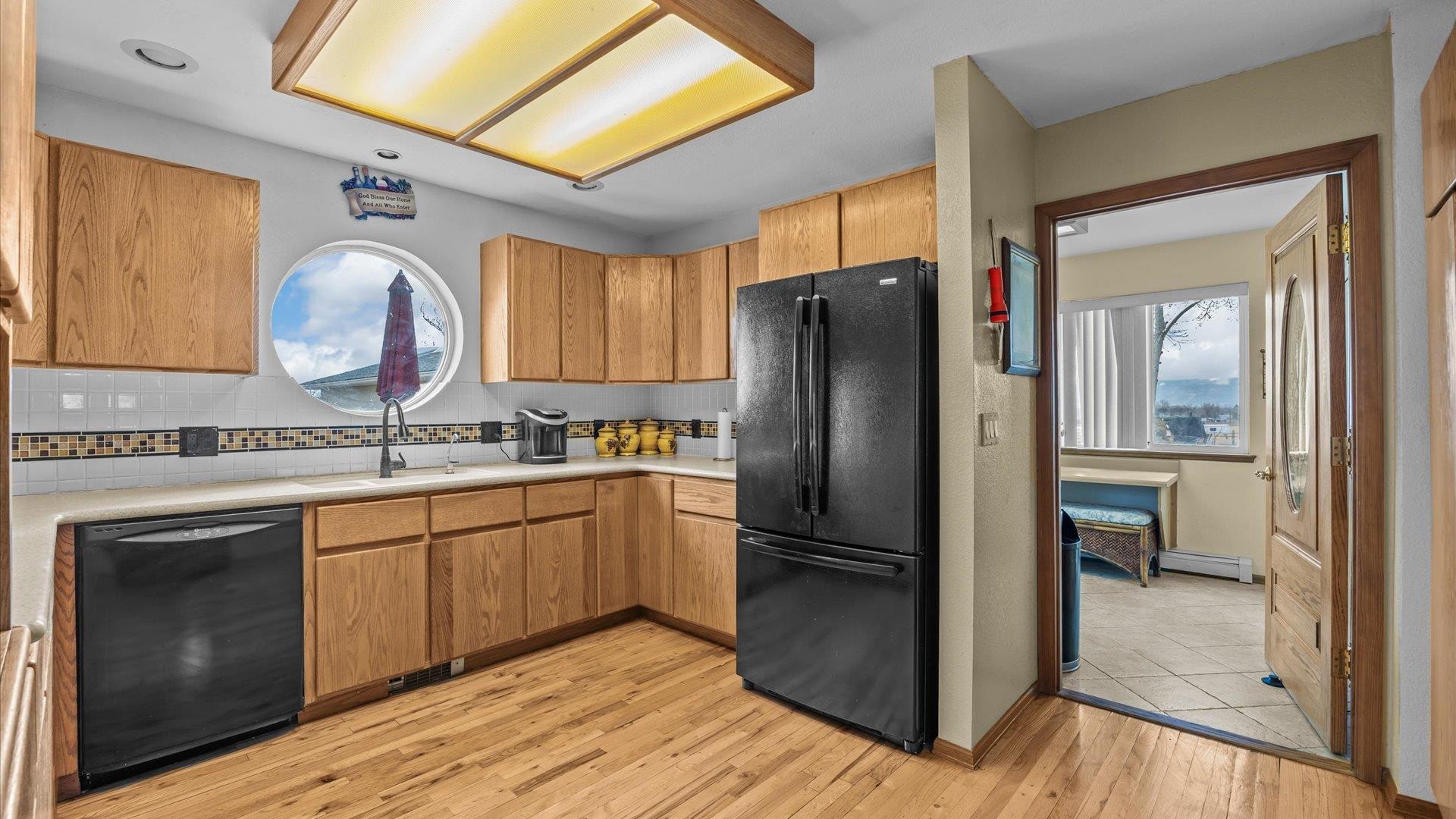 1456 17 Road Fruita, CO 81521 - Photo 10 of 42 a kitchen with stainless steel appliances granite countertop a refrigerator stove and sink