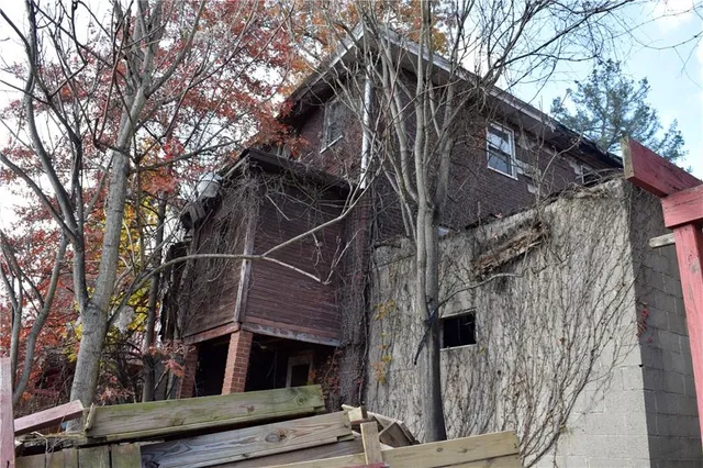 a view of a house with a tree