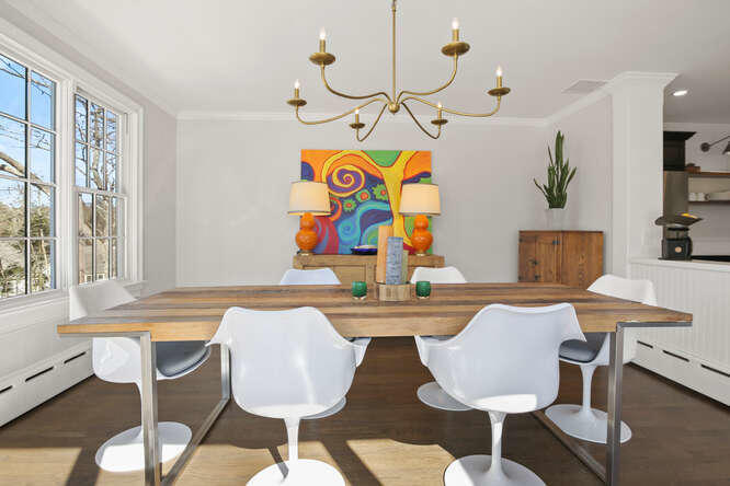 67 Hickok Road New Canaan, CT 06840 - Photo 16 of 56 a view of a dining room with furniture window and wooden floor