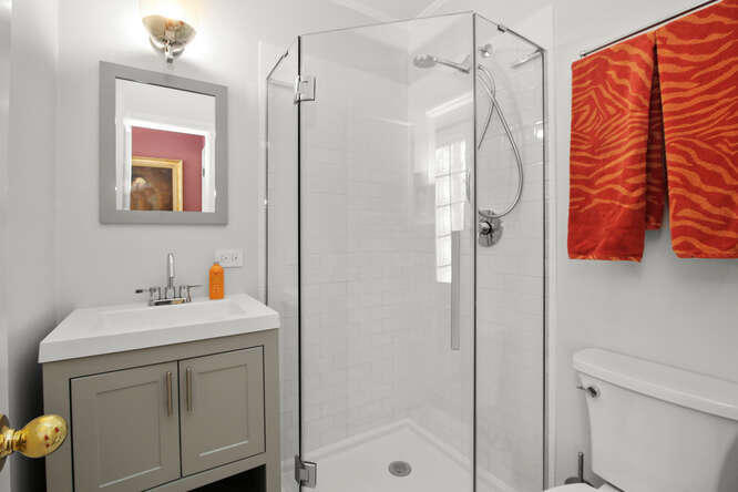 67 Hickok Road New Canaan, CT 06840 - Photo 29 of 56 a bathroom with a sink mirror and a shower