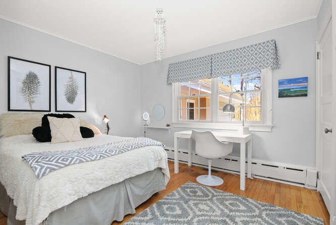 67 Hickok Road New Canaan, CT 06840 - Photo 41 of 56 a bedroom with a bed and wooden floor