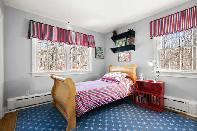 67 Hickok Road New Canaan, CT 06840 - Photo 43 of 56 a bedroom with a bed and wooden floor