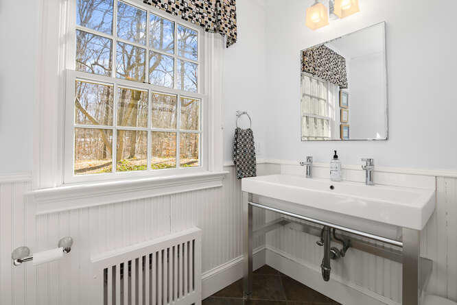 67 Hickok Road New Canaan, CT 06840 - Photo 44 of 56 a view of a sink and a window