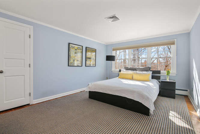 67 Hickok Road New Canaan, CT 06840 - Photo 46 of 56 a bedroom with a large bed and a window