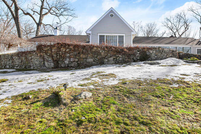 67 Hickok Road New Canaan, CT 06840 - Photo 50 of 56 a view of a backyard of the house
