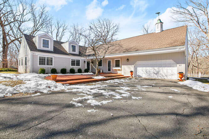67 Hickok Road New Canaan, CT 06840 - Photo 52 of 56 a front view of a building with street view