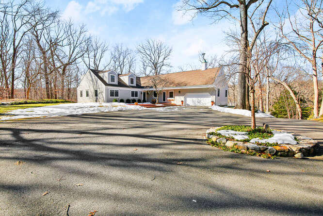 67 Hickok Road New Canaan, CT 06840 - Photo 53 of 56 a front view of a house with a yard