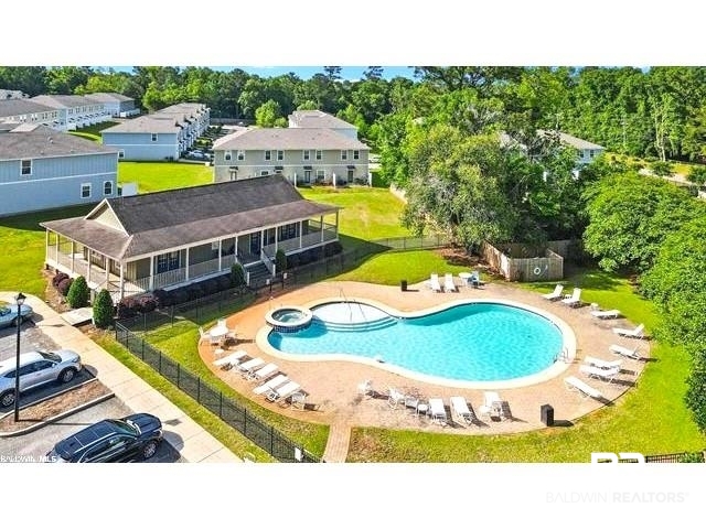 25806 Pollard Road, Unit 20 Daphne, AL 36526 - Photo 27 of 29 View of pool with a patio area and a yard