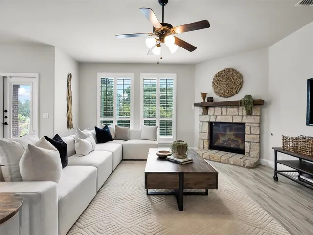 a living room with furniture and a fireplace