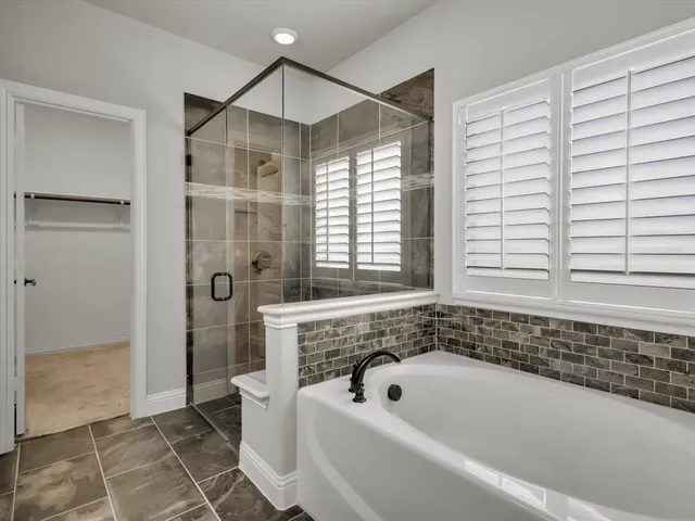 a bedroom with bed and a chandelier