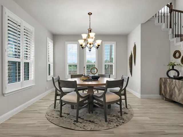 a view of a dining room with furniture window and outside view