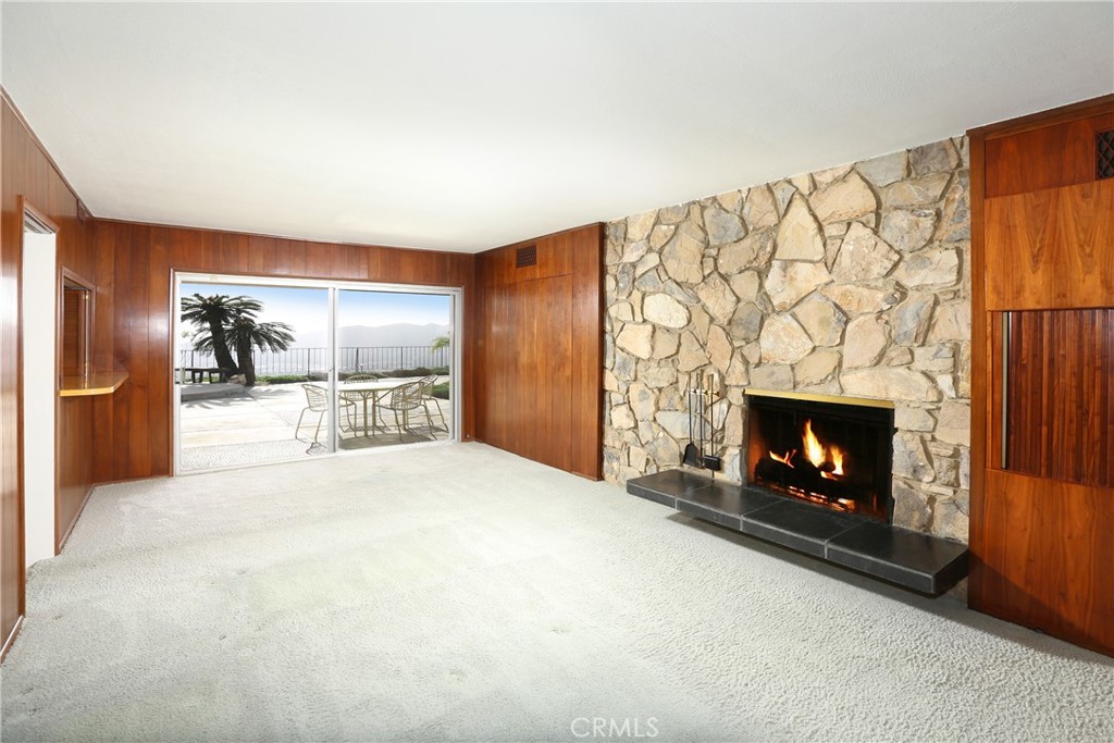 300 Wonderview Drive Glendale, CA 91202 - Photo 3 of 11 a room with a fireplace and a fireplace