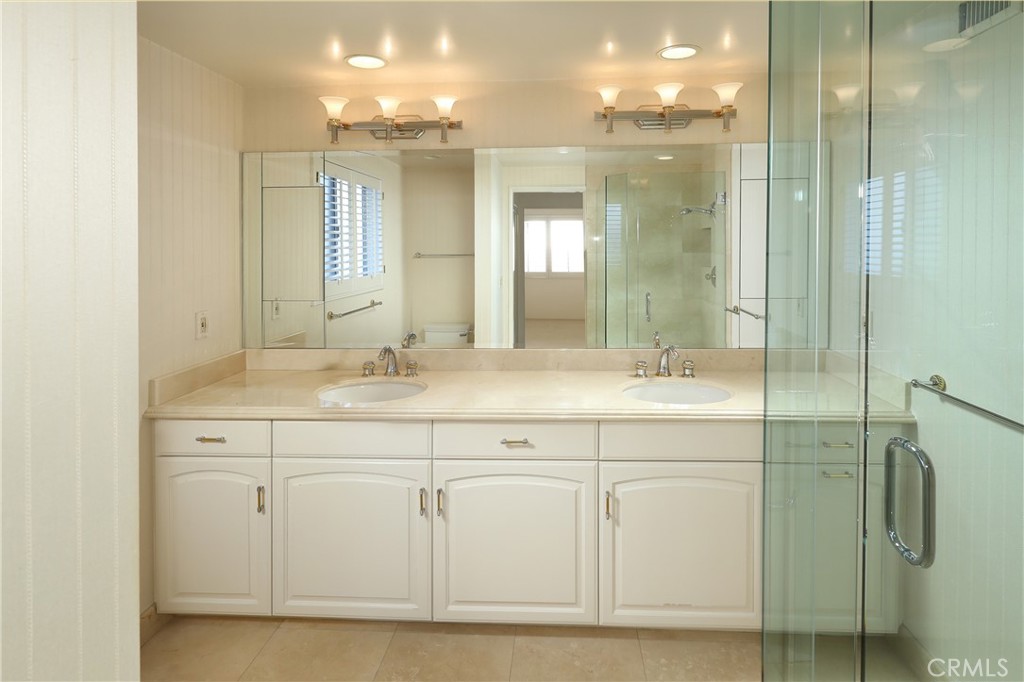 300 Wonderview Drive Glendale, CA 91202 - Photo 7 of 11 a bathroom with a double vanity sink and mirror