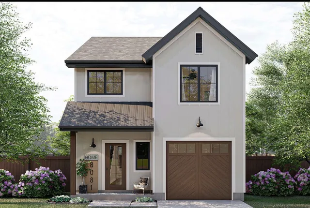 a front view of a house with a garden