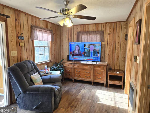 a living room with furniture and a window