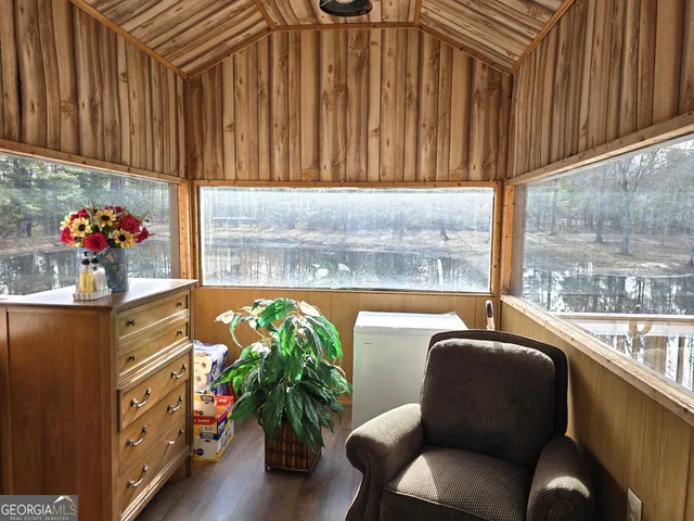 a living room with furniture and flowers