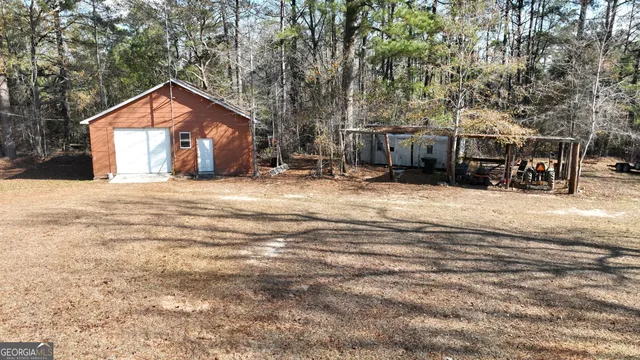 a view of a house with snow in front of house