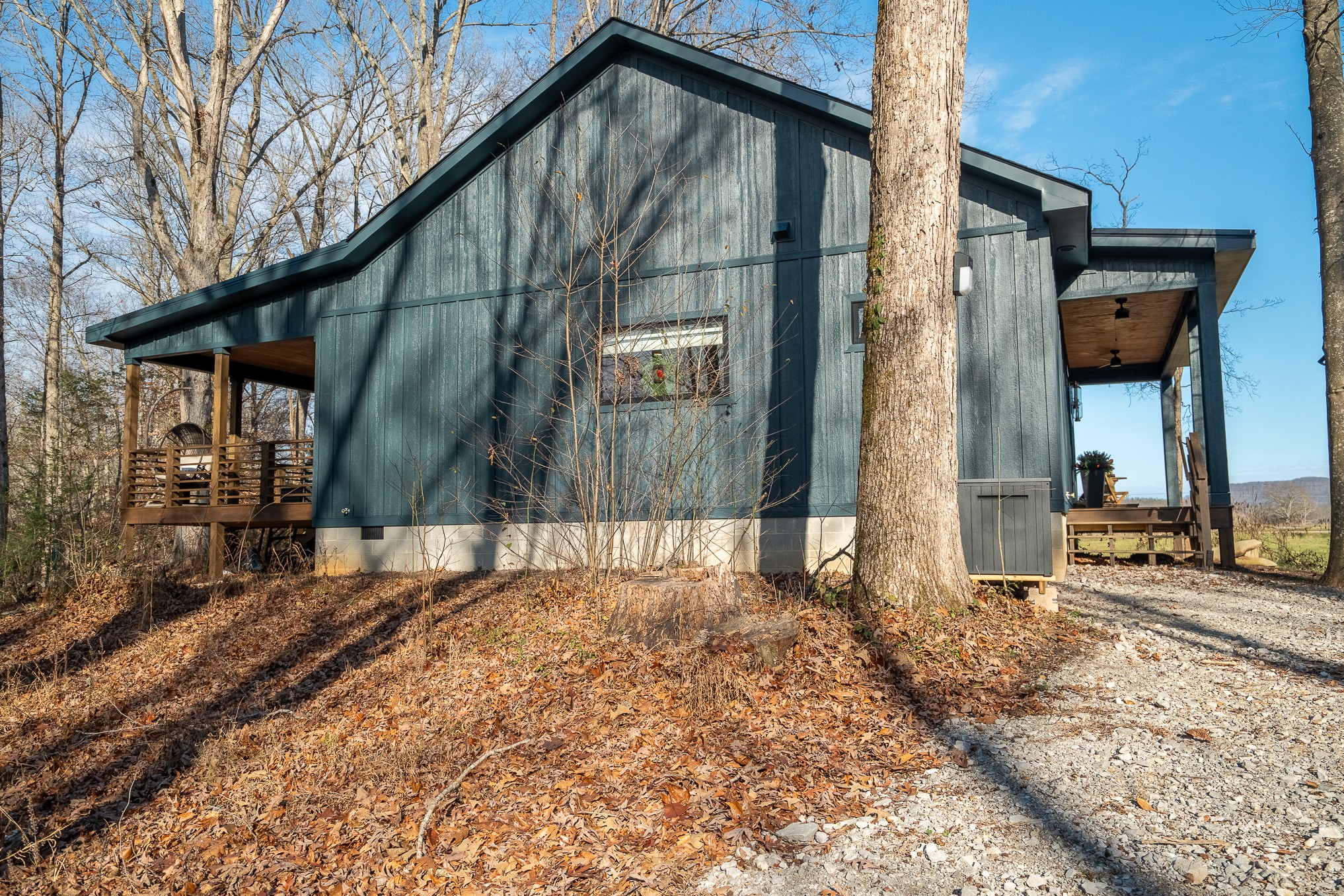 1545 Blue Springs Road Sparta, TN 38583 - Photo 10 of 99 a backyard of a house with barbeque oven table and chairs