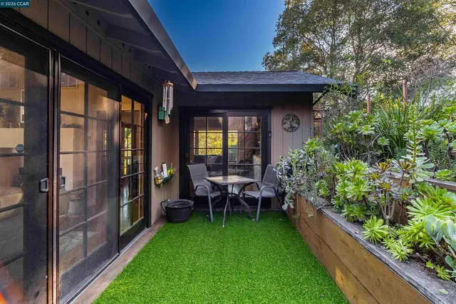 a kitchen with stainless steel appliances granite countertop a refrigerator sink and white cabinets