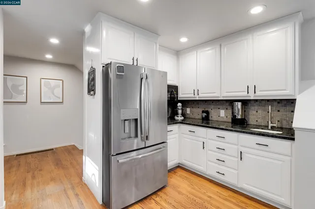 a bedroom with furniture and a potted plant