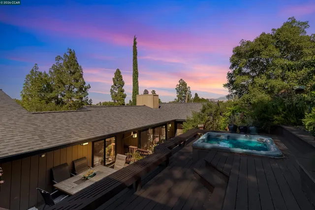 a view of balcony with wooden floor