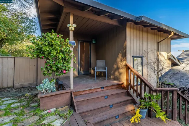 a bedroom with a large bed and a flat screen tv