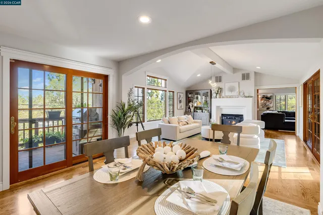 a spacious bedroom with a large bed and a dresser