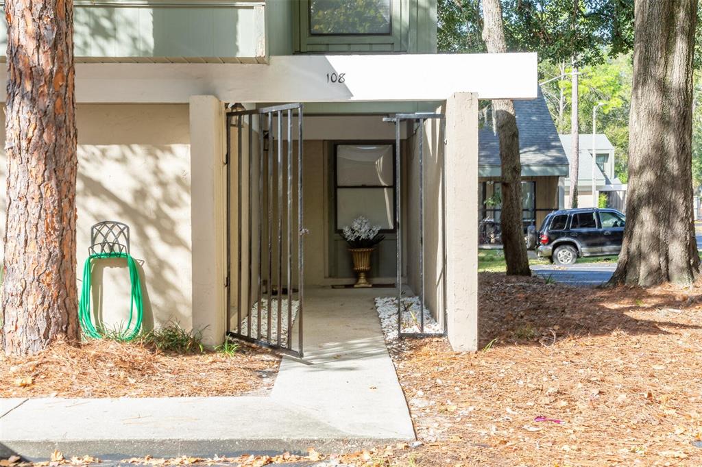 7200 Southwest 8th Avenue, Unit Q108 Gainesville, FL 32607 - Photo 1 of 1 a view of a house with a porch