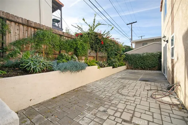 a view of a back yard with potted plants