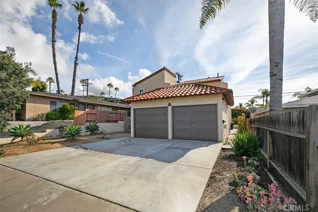 a front view of a house with a garage