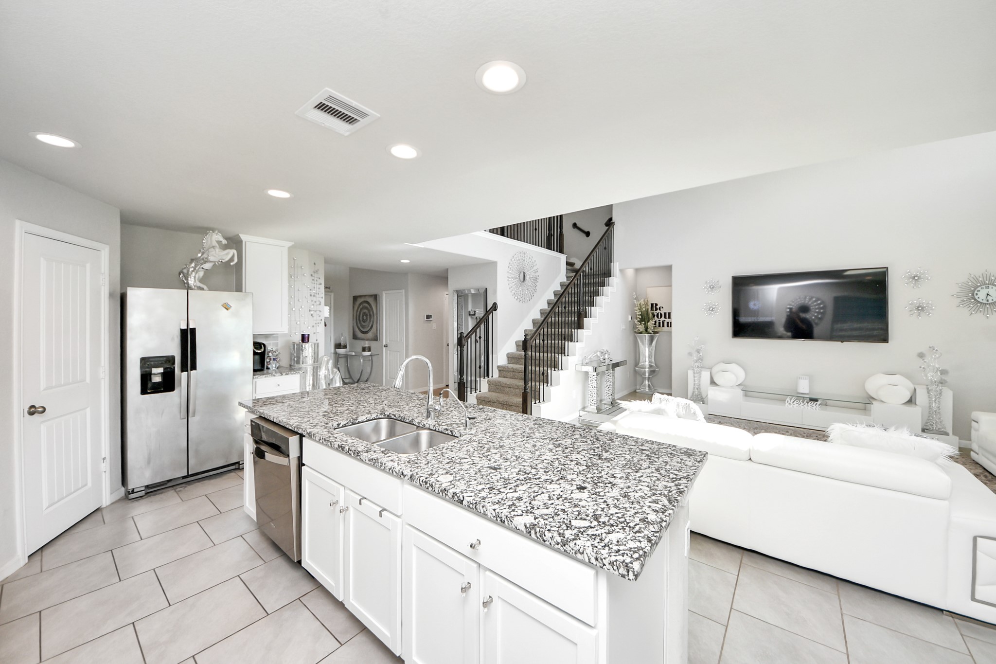 3514 Windham Way Katy, TX 77494 - Photo 27 of 42 a kitchen with stainless steel appliances kitchen island granite countertop a sink and cabinets