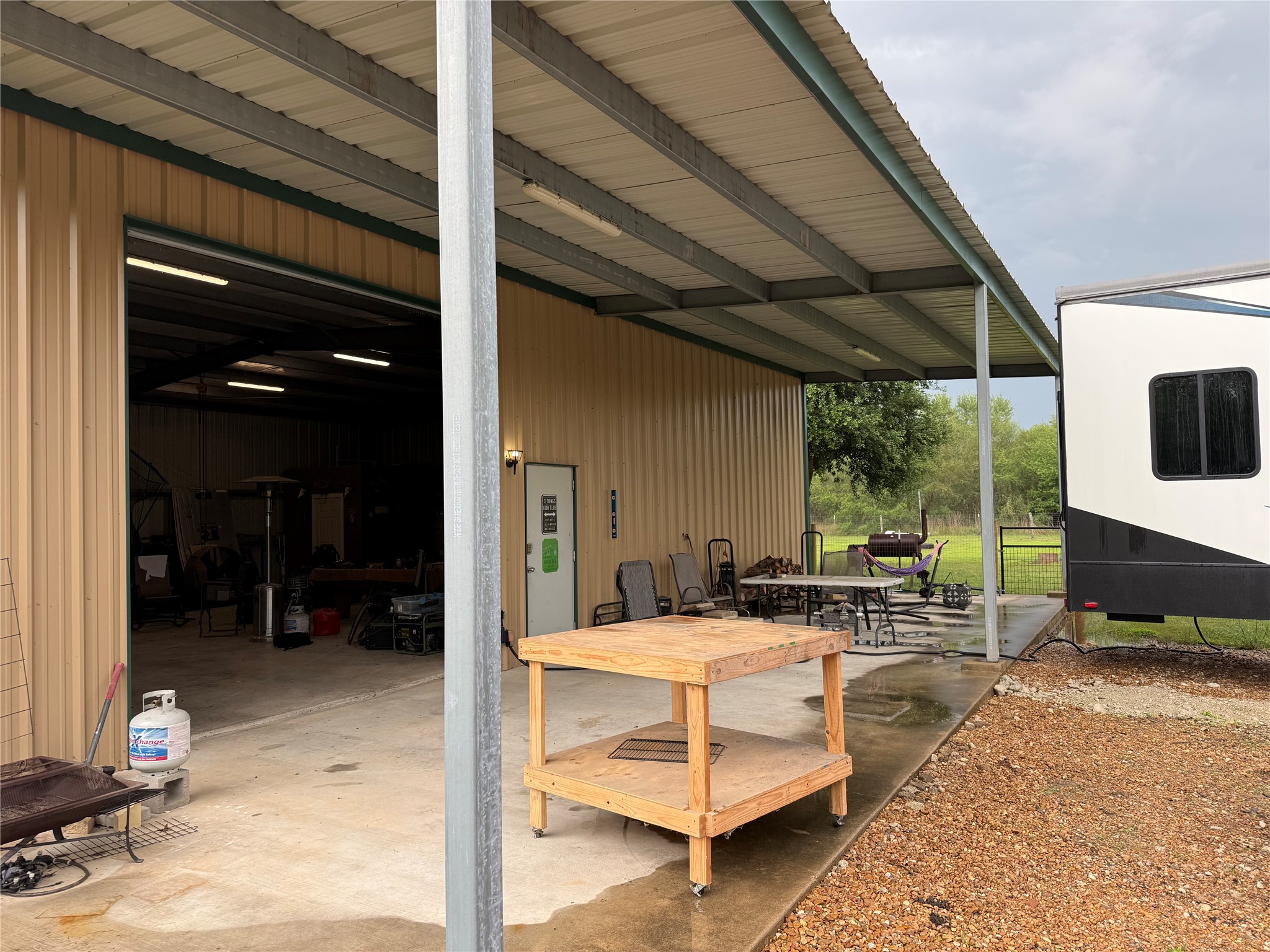 2015 Skrivanek Road Sealy, TX 77474 - Photo 13 of 38 750 sq. ft. covered patio off the shop