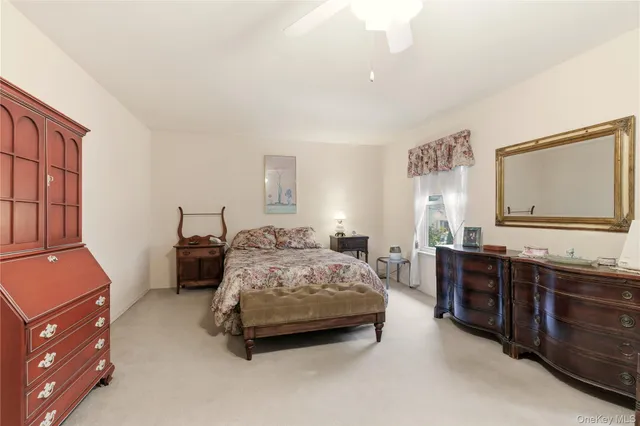 a bedroom with a bed and dresser