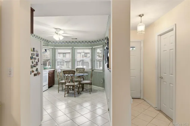 a view of a dining room with furniture window and outside view