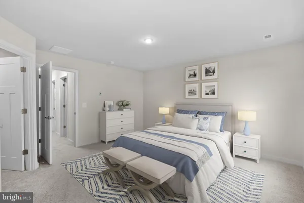 a bedroom with a bed and a view of bathroom