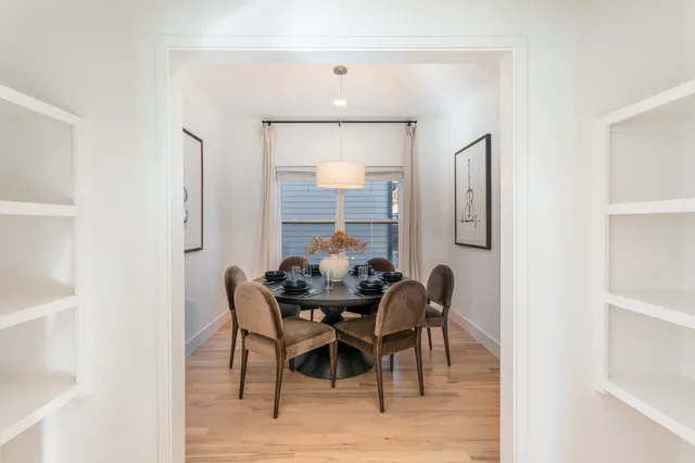 a dining room with furniture and window