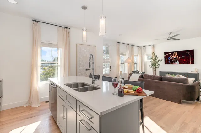 a kitchen with a stove a sink and a refrigerator