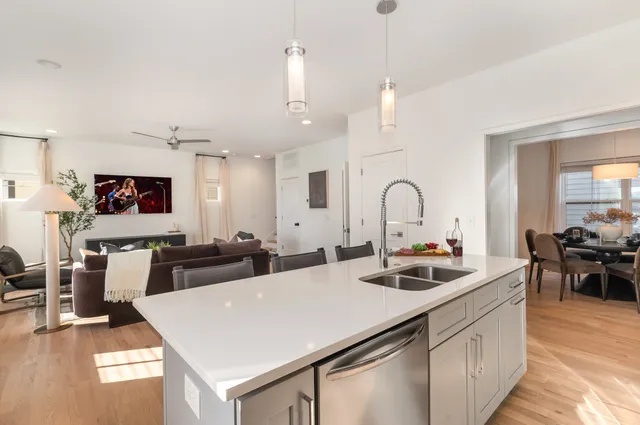 a kitchen with counter top space appliances and windows
