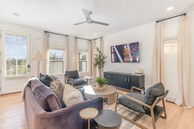 a living room with furniture and a large window