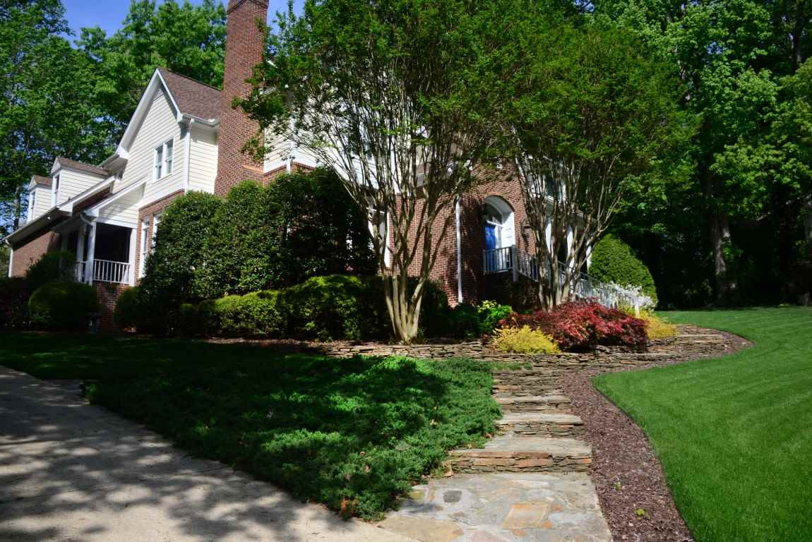 8808 Ross Court Raleigh, NC 27613 - Photo 1 of 25 Lovely stone walkway and excellent landscaping lead you to the front door. Exterior Front