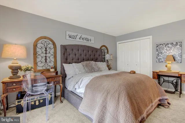 a bed room with a bed and a chair