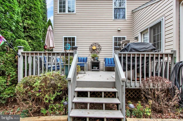 a backyard of a house with yard and outdoor seating