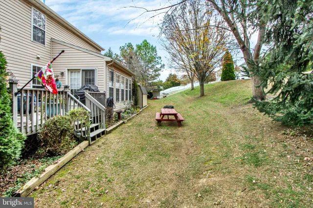 a view of a house with backyard porch and sitting area