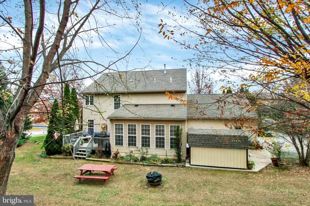 a view of a house with a yard and garage