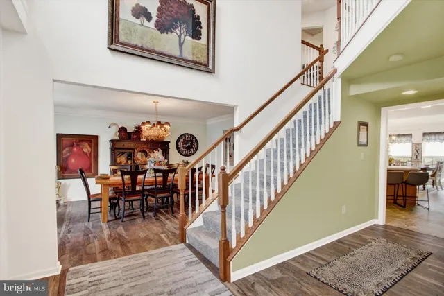 a view of dining room and hall with wooden floor