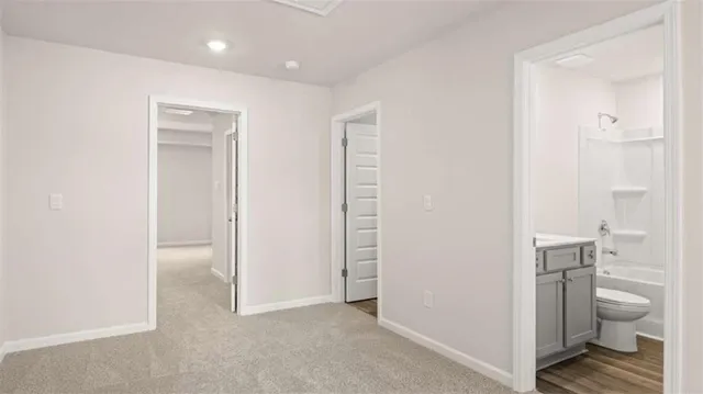a view of bathroom with a toilet and a shower