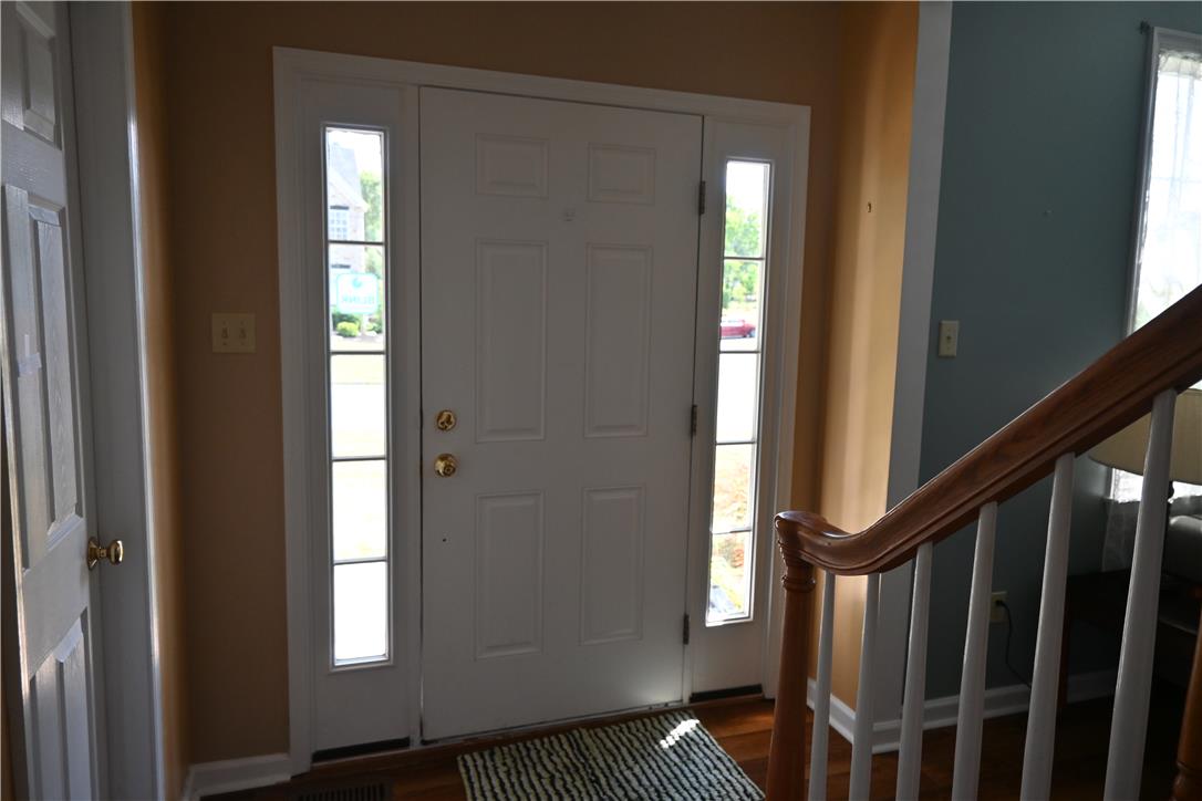 3829 East Hopewell Road Center Valley, PA 18034 - Photo 2 of 52 A welcoming front entry features a classic white door flanked by elegant sidelights, illuminating the interior.