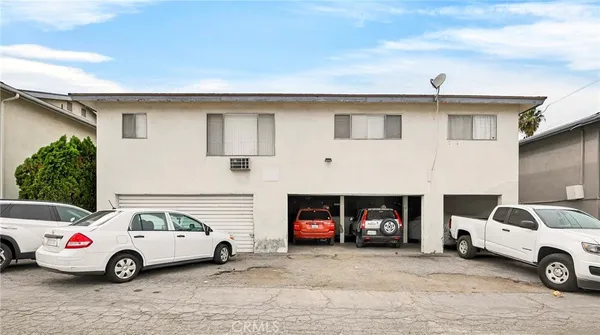 a view of car parked in front of house